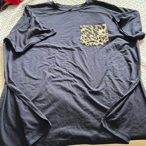 Blue t shirt with cheetah pocket, slits at bottom to make more dressy